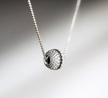 Load image into Gallery viewer, Radiant Silver Sphere Necklace&lt;br&gt;w/White Pavé Diamonds&lt;br&gt;&amp; Black Diamond Accent
